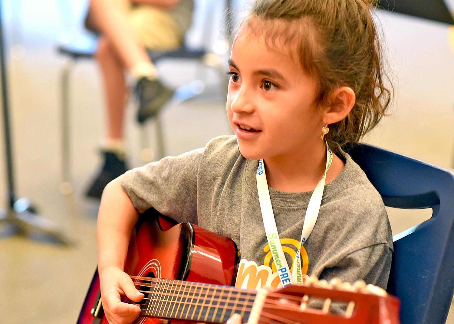 Camper playing guitar